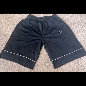 Mens large black Nike shorts with white.